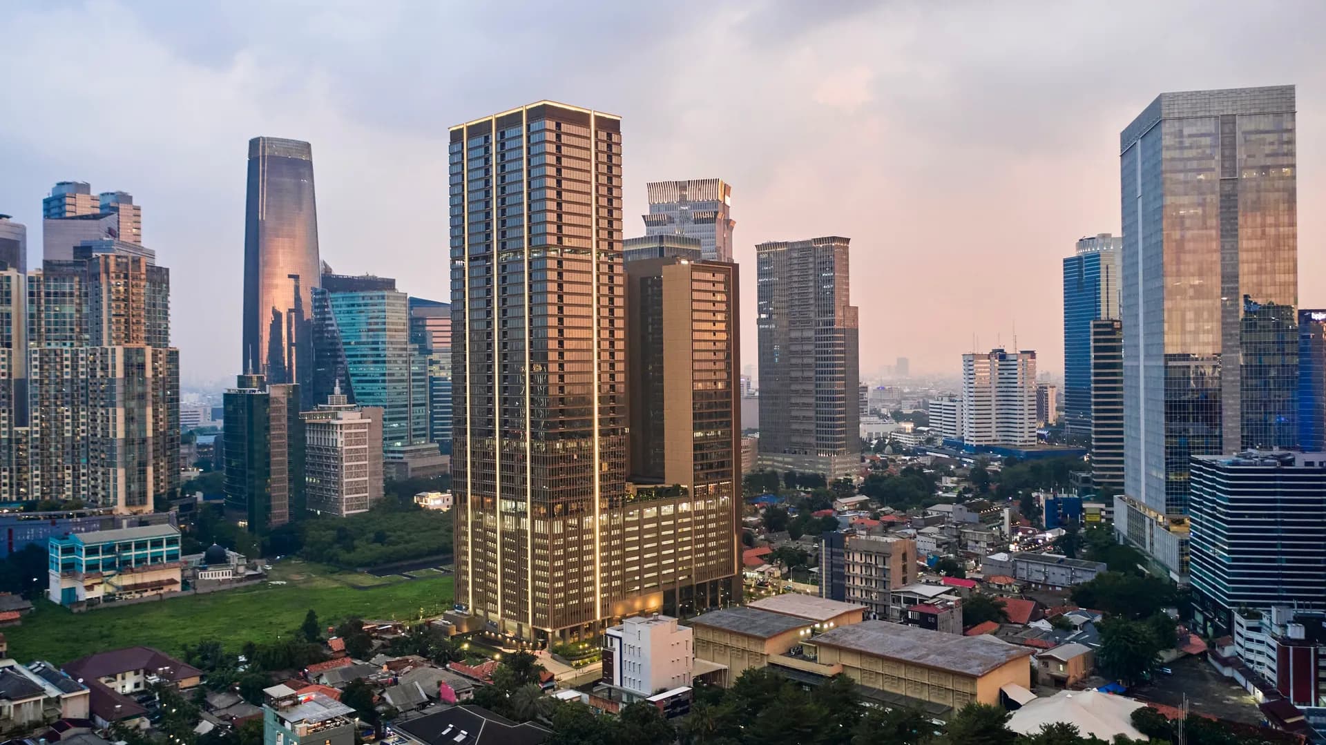 BRANZ Mega Kuningan luxury apartment building exterior with modern architecture in Jakarta's prestigious Kuningan district